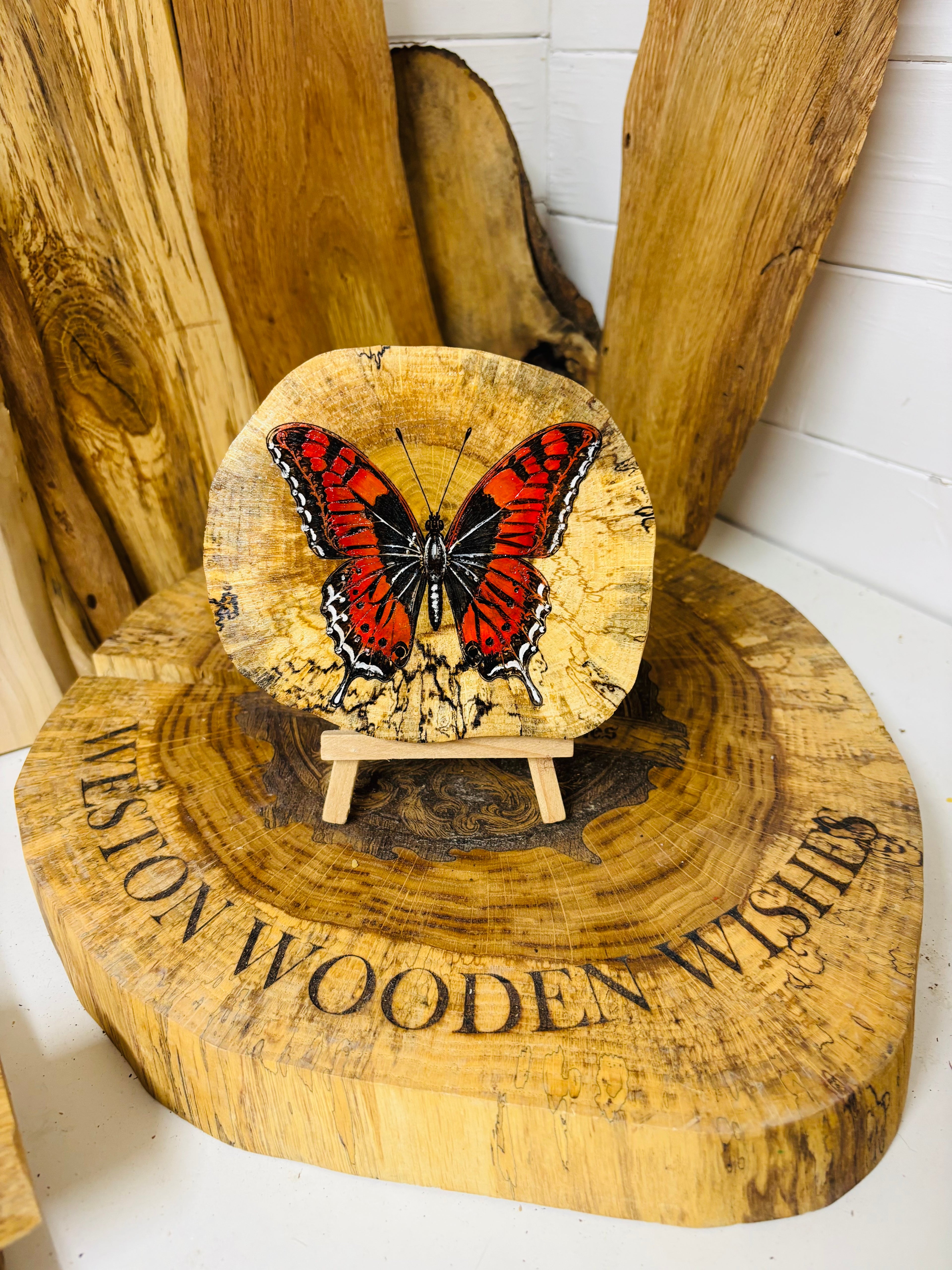 Beautiful butterfly , laser engraved and hand painted onto a slice spalted oak