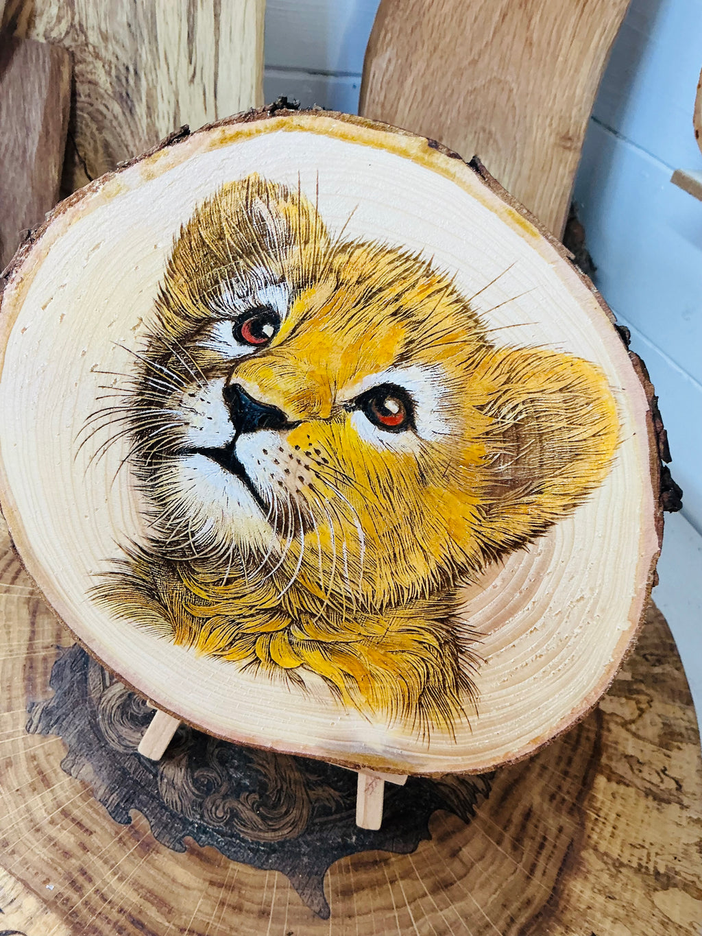 Lion Cub laser engraved and hand painted onto large log slice with stand