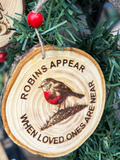 Robins appear hanging logs slice with twine and bead