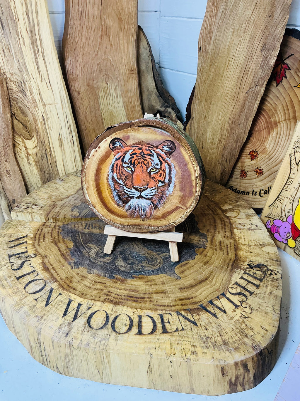 Majestic tiger laser engraved and hand painted onto a slice of cherry wood with stand