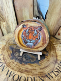 Majestic tiger laser engraved and hand painted onto a slice of cherry wood with stand