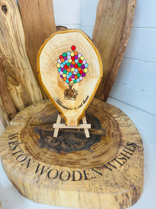 Balloons laser engraved and hand painted onto  very unique balloon shaped logslice with stand